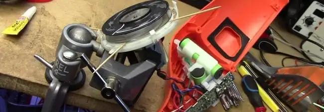 Vacuum cleaner repair parts and tools on a workbench in Columbia, MO